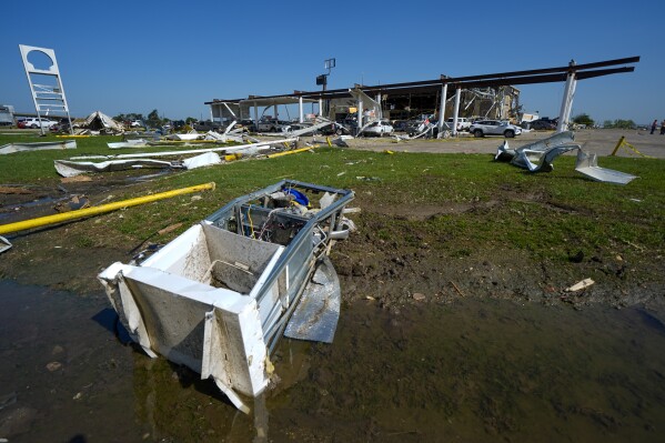 A gas pump lies in a ditch the morning after a tornado passed through in Valley View, Texas, Sunday, May 26, 2024. Violent storms left a wide trail of destruction in Texas, Oklahoma and Arkansas on Sunday after destroying homes and destroying a rest area where drivers sought shelter during the latest deadly weather in the central U.S. (AP Photo/Julio Cortez)