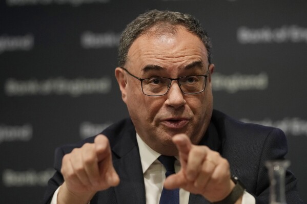 FILE - Governor of the Bank of England Andrew Bailey speaks as he attends a news conference for the Monetry Policy Report August 2023, at the Bank of England in London on Aug. 3, 2023. The British economy unexpectedly grew in the second quarter of the year largely as a result of a strong rebound in June when many businesses, particularly in the leisure sector benefited from the warm and settled weather, official figures showed Friday, Aug. 11. (AP Photo/Alastair Grant, Pool, File)