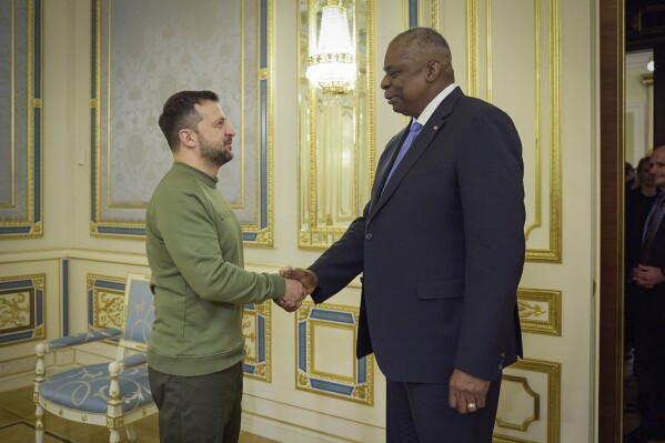 In this photo provided by the Ukrainian Presidential Press Office, Ukrainian President Volodymyr Zelenskyy, left, shakes hands with U.S. Secretary of Defense Lloyd Austin in Kyiv, Ukraine, Monday, Nov. 20, 2023. (Ukrainian Presidential Press Office via AP)