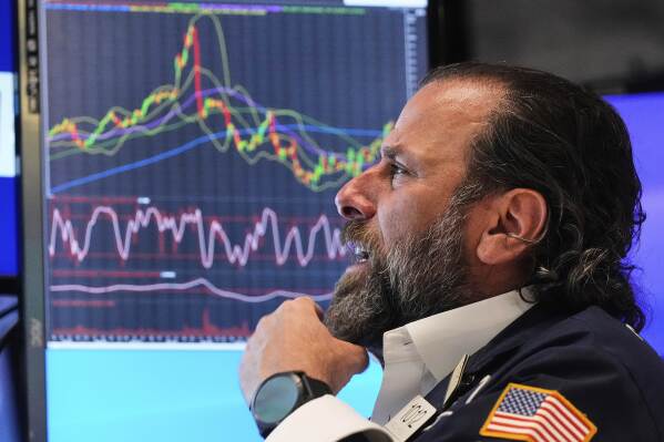 Specialist Michael Pistillo works at his post on the floor of the New York Stock Exchange, Monday, May 12, 2025. (AP Photo/Richard Drew)