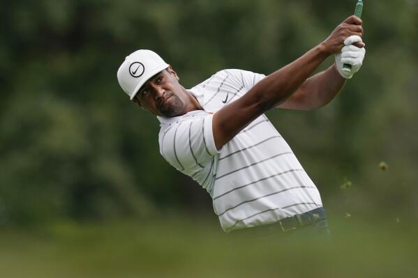 Tony Finau drives from the ninth tee during the first round of the Rocket Mortgage Classic golf tournament, Thursday, July 28, 2022, in Detroit. (AP Photo/Carlos Osorio)