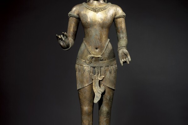 This March 2007 photo shows a bronze sculpture titled "Standing Shiva" at the Metropolitan Museum of Art in New York. The sculpture is one of 16 pieces of artwork that the museum said it will return to Cambodia and Thailand that federal prosecutors say were tied to an art dealer and collector accused of running a huge antiquities trafficking network out of Southeast Asia. (Metropolitan Museum of Art via AP)