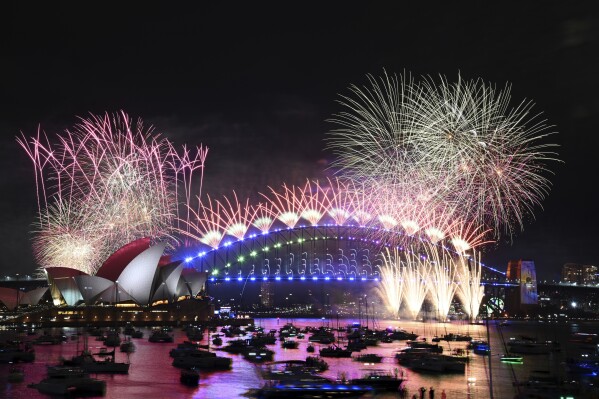 Fireworks explode over the Sydney Opera House and on the Harbour Bridge as part if New Year's Eve celebrations in Sydney, Monday, Jan. 1, 2024. (Dan Himbrechts/AAP Image via AP)