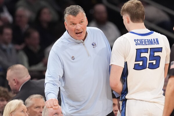 Creighton coach Greg McDermott talks to guard Baylor Scheierman during the second half of the team's NCAA college basketball game against Providence in the quarterfinals of the Big East Conference men's tournament Thursday, March 14, 2024, in New York. (AP Photo/Mary Altaffer)