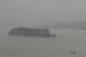 A boat sails on Musi River as thick haze from forest fires shroud the city of Palembang, South Sumatra, Indonesia, Monday, Oct. 2, 2023. Officials on Indonesia’s Sumatra island on Monday asked residents to work from home as more than 300 forest and peatland fires were causing widespread haze in the region. (AP Photo/Muhammad Hatta)