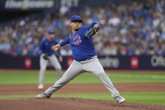 Chicago Cubs starting pitcher Javier Assad works against the Toronto Blue Jays during the first inning of a baseball game Friday, Aug. 11, 2023, in Toronto. (Chris Young/The Canadian Press via AP)