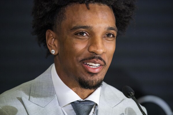 LSU quarterback Jayden Daniels, a Heisman Trophy finalist, speaks during a news conference before the award ceremony, Saturday, Dec. 9, 2023, in New York. (AP Photo/Eduardo Munoz Alvarez)