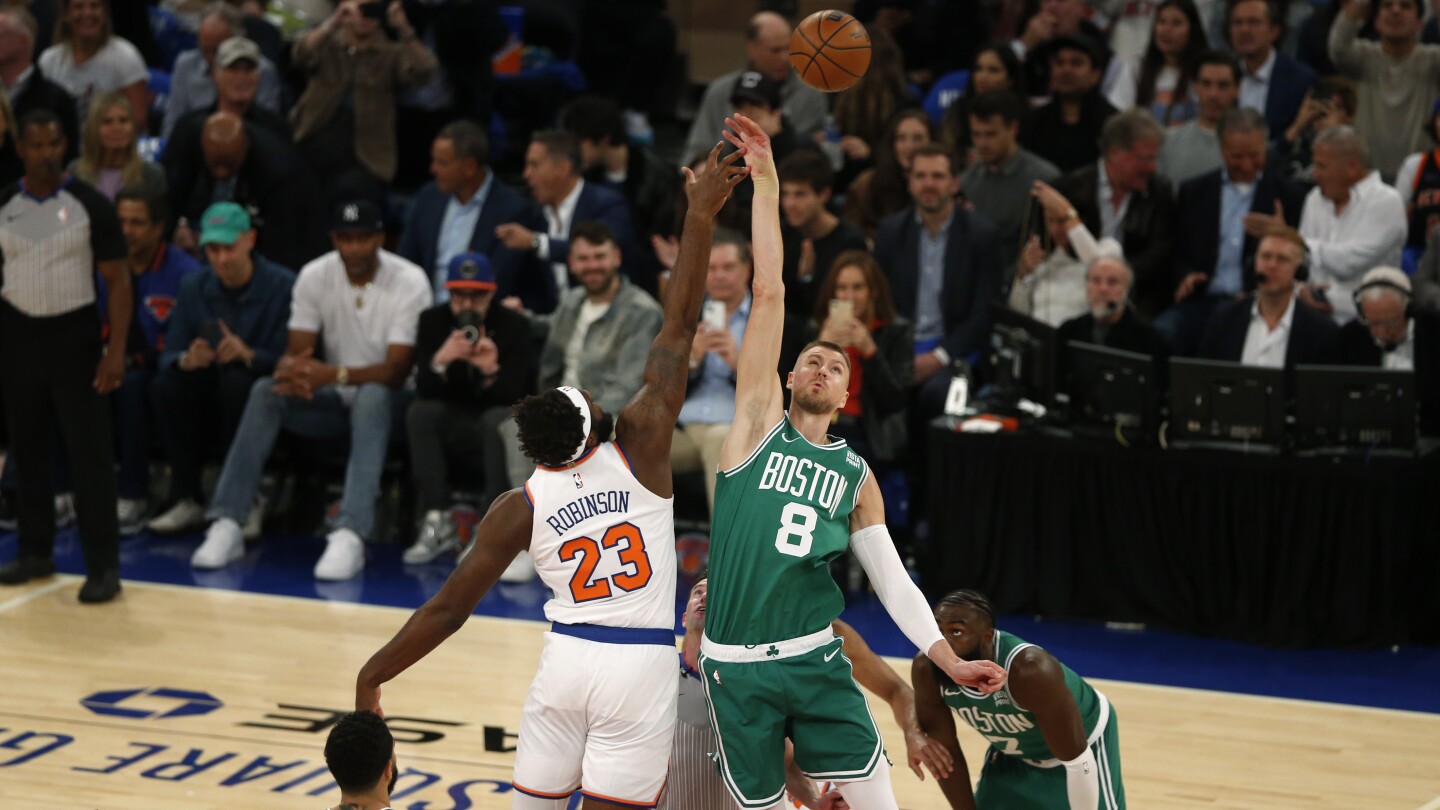 Porzingis makes tiebreaking 3-pointer in strong Celtics debut, helps Boston beat Knicks 108-104
