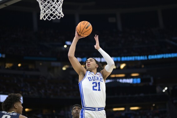 FILE - Duke center Christian Reeves (21) goes up to shoot during the second half of a first-round college basketball game against Oral Roberts in the NCAA Tournament, Thursday, March 16, 2023, in Orlando, Fla. Former Duke center Christian Reeves has signed to play at Clemson, one of the Blue Devils' Atlantic Coast Conference rivals. Tigers coach Brad Brownell officially announced the addition of Reeves on Monday, May 13, 2024. (AP Photo/Phelan M. Ebenhack, File)
