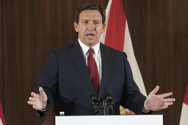 FILE - Florida Gov. Ron DeSantis speaks at a news conference on Jan. 26, 2023, in Miami. David McIntosh, the president ofthe influential Club For Growth group, said Tuesday, Feb. 7, that the group has invited a half dozen potential Republican candidates for the White House to its donor summit in Florida next month including DeSantis. (AP Photo/Marta Lavandier, File)
