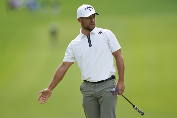 Xander Schauffele reacts to a putt on the 12th hole during the second round of the Wells Fargo Championship golf tournament at Quail Hollow on Friday, May 10, 2024, in Charlotte, N.C. (AP Photo/Erik Verduzco)