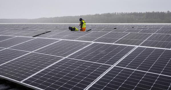 FILE - Solar panels are installed at a floating photovoltaic plant on a lake in Haltern, Germany, on April 1, 2022. Russia's Gazprom says it is halting natural gas supplies to Poland and Bulgaria, escalating tensions between the Kremlin and Europe over energy and Russia's invasion of Ukraine — and adding new urgency to plans to reduce and then end the continent's dependence on Russia as a supplier of oil and gas. (AP Photo/Martin Meissner)