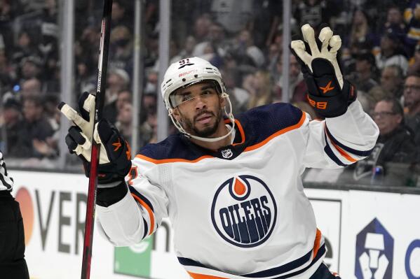 FILE - Edmonton Oilers left wing Evander Kane gestures after scoring an empty net goal during the third period in Game 6 of an NHL hockey Stanley Cup first-round playoff series against the Los Angeles Kings, Thursday, May 12, 2022, in Los Angeles. Evander Kane has been granted permission by the Edmonton Oilers to meet with other teams, while the two sides are still in discussion to reach a contract agreement before he’s eligible to become an unrestricted free agent on Wednesday, July 13. (AP Photo/Mark J. Terrill, File)