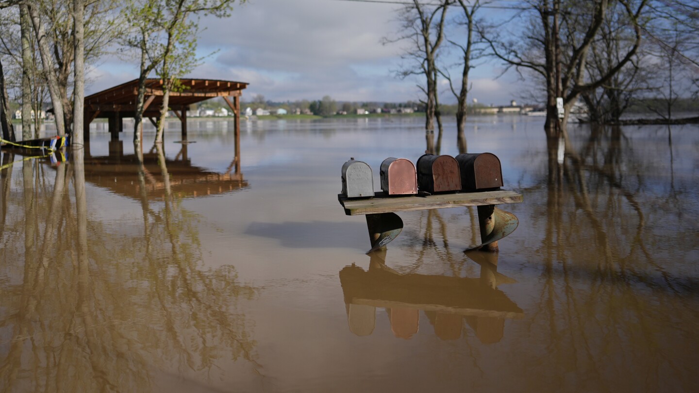 Kentucky watches for surging rivers to recede so widespread cleanup can begin