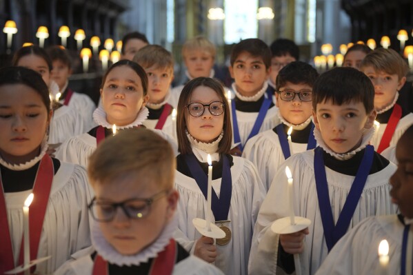 The Choristers of St Paul's choir, including girls for first time in 900-year history, rehearse for the Christmas services in St Paul's Cathedral, in London, Monday, Dec. 23 2024. (AP Photo/Kin Cheung)