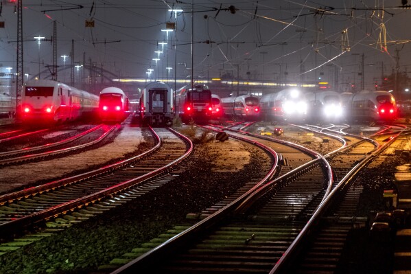 Trains are parked outside the central train station in Frankfurt, Germany, Friday, Dec. 8, 2023, when train drivers of the GDL union went on a 24-hour-strike. (AP Photo/Michael Probst)