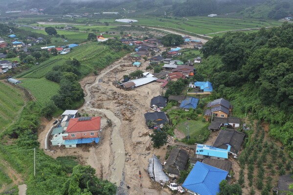 Houses collapsed from a landslide caused by heavy rain are seen in Yecheon, South Korea, Sunday, July 16, 2023. (Yun Kwan-shick/Yonhap via AP)