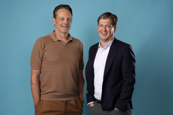 Actor-executive producer Vince Vaughn, left, and creator-executive producer Bill Lawrence, of the Apple TV+ series "Bad Monkey," pose for a portrait at the Four Seasons Hotel, Tuesday, Aug. 6, 2024, in Los Angeles. (AP Photo/Chris Pizzello)