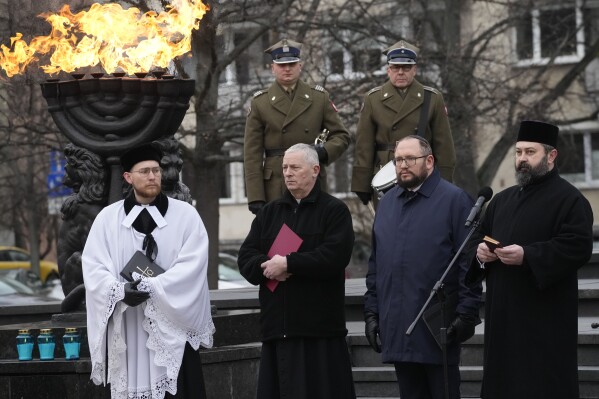 Leaders of various religions attend ceremonies on the eve of the 79th anniversary of the liberation of the Nazi German death camp of Auschwitz-Birkenau by Soviet troops, at the Monument to the Heroes of the Ghetto, in Warsaw, Poland, on Friday, Jan.26, 2024. (AP Photo/Czarek Sokolowski)