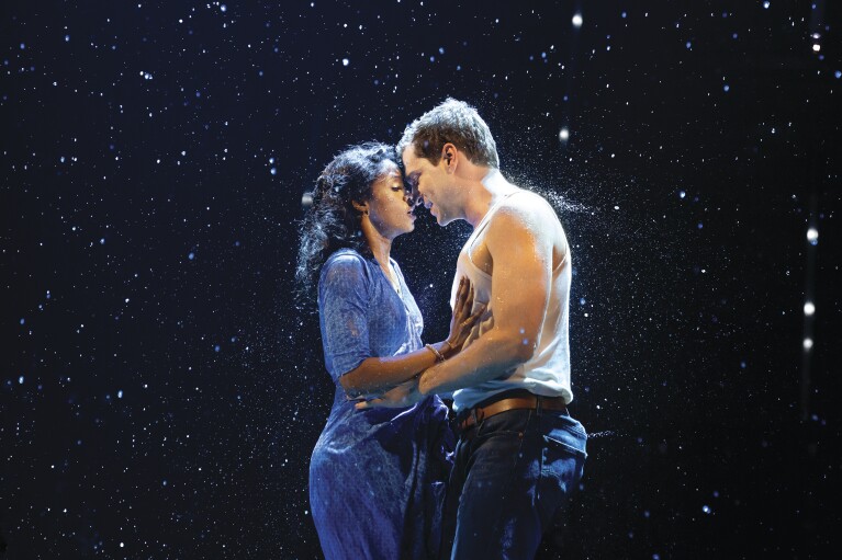 This image released by Boneau/Bryan-Brown shows Ryan Vasquez, right, and Joy Woods during a performance of "The Notebook." (Julieta Cervantes/Boneau/Bryan-Brown via AP)