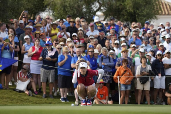 Solheim Cup team US golfer Nelly Korda lines up a putt during the foursomes play at the Solheim Cup in Finca Cortesin, near Casares, southern Spain, on Friday, Sept. 22, 2023. (AP Photo/Bernat Armangue)