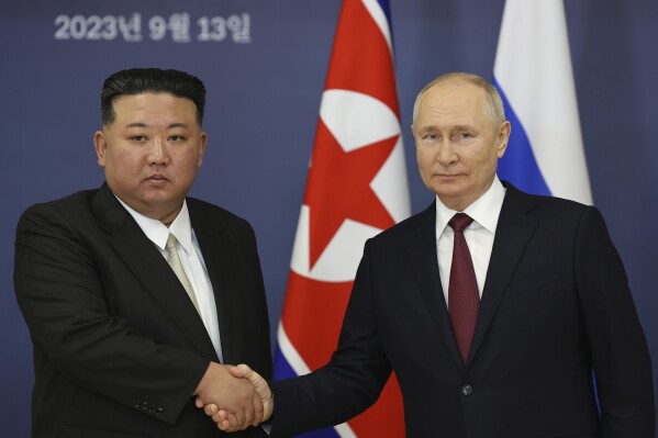 Russian President Vladimir Putin, right, and North Korea's leader Kim Jong Un shake hands during their meeting at the Vostochny cosmodrome outside the city of Tsiolkovsky, about 200 kilometers (125 miles) from the city of Blagoveshchensk in the far eastern Amur region, Russia, on Wednesday, Sept. 13, 2023. (Vladimir Smirnov, Sputnik, Kremlin Pool Photo via AP)