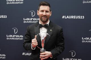 Argentine soccer player Lionel Messi poses after he was presented the award for sportsperson of the year at the Laureus Sports Awards ceremony in Paris, Monday, May 8, 2023. (AP Photo/Lewis Joly)
