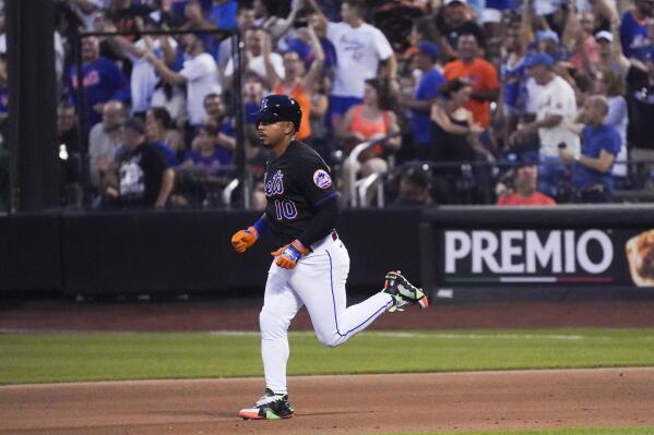 New York Mets' Eduardo Escobar runs the bases after his home run in the fourth inning of the team's baseball game against the Texas Rangers, Friday, July 1, 2022, in New York. (AP Photo/Bebeto Matthews)