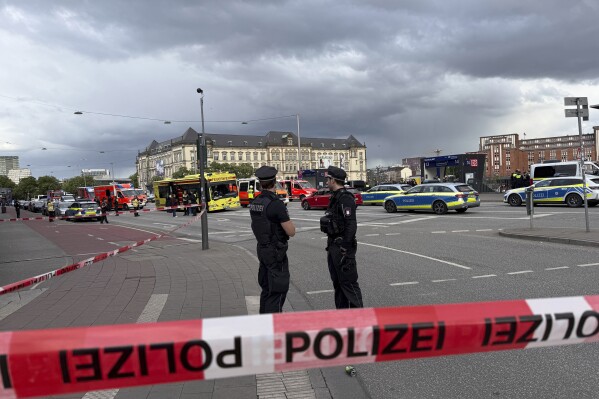 Police near the scene of a stabbing at Hamburg Central Station in Hamburg, Germany, Friday, May 23, 2025. (Steven Hutchings/dpa via AP)