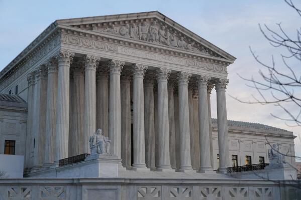 FILE - The Supreme Court building is seen on Capitol Hill in Washington, Jan. 10, 2023. The Supreme Court is off to a historically slow start in failing to resolve any cases in which it has heard arguments since early October. By this point, more than three months after the start of the court's term, the justices had until now always decided at least one case, and usually a handful. (AP Photo/Patrick Semansky, File)