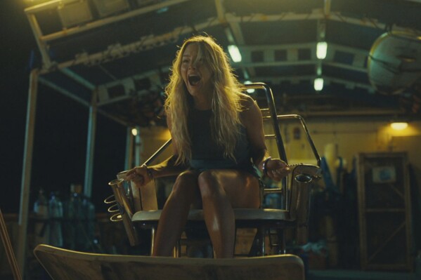 This image released by IFC Films shows Hassie Harrison in a scene from "Dangerous Animals." (IFC Films via AP)