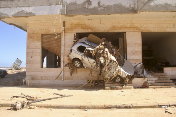 Damage from massive flooding is seen in Derna, Libya, Wednesday, Sept.13, 2023. Search teams are combing streets, wrecked buildings, and even the sea to look for bodies in Derna, where the collapse of two dams unleashed a massive flash flood that killed thousands of people. (AP Photo/Yousef Murad)