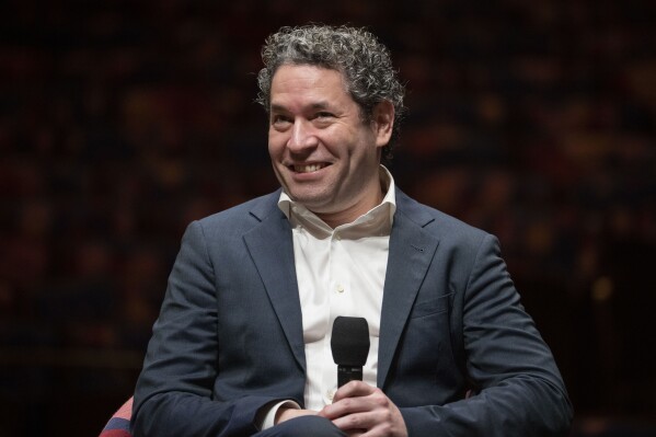 FILE - Gustavo Dudamel is introduced as the New York Philharmonic's 27th music and artistic director in New York on Feb. 20, 2023. Dudamel will conduct the New York Philharmonic at its spring gala on April 24, the orchestra said as it announced a $40 million gift from co-chairman Oscar L. Tang and wife Agnes Hsu-Tang that will endow his position. (AP Photo/John Minchillo, File)