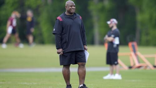 Washington Commanders assistant head coach/offensive coordinator Eric Bieniemy watches the NFL football team's rookie minicamp, Friday, May 12, 2023, in Ashburn, Va. (AP Photo/Patrick Semansky)