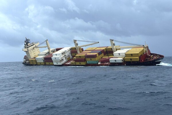 In this photo released by Indian Coast Guard, the Liberia-flagged MSC ELSA 3, a container ship carrying hazardous cargo sinks off Indian southern coast in the Arabian Sea Sunday, May 25, 2025. (Indian Coast Guard vis AP)