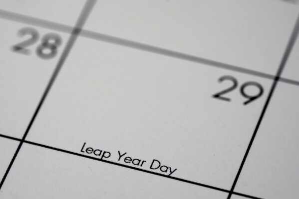 February, 29, otherwise know as leap year day, is shown on a calendar Sunday, Feb. 25, 2024, in Overland Park, Kan. Because it actually takes a bit longer than 365 days for the Earth to revolve around the sun, an extra day is added to the calendar in February every four years to make up make up for the that extra time. (AP Photo/Charlie Riedel)