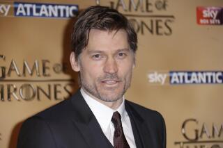 FILE - In this March 18, 2015, file photo, Nikolaj Coster-Waldau poses for photographers upon arrival at the Tower of London for the world premiere of Game of Thrones, season 5, in London. “Gods of Egypt,” a fantasy epic based on mythology and set in ancient times, stars Scottish actor Gerard Butler and Danish actor Coster-Waldau as Egyptian gods Set and Horus. (Photo by Joel Ryan/Invision/AP, File)