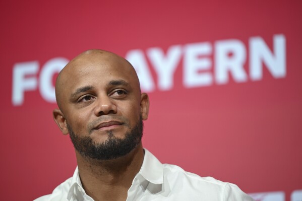 Vincent Kompany is presented as the new coach of Bayern Munich, at the Allianz Arena, in Munich, Germany, Thursday, May 30, 2024. Kompany is the unlikely new coach of Bayern Munich after a lengthy search which saw the German club rejected by several top candidates. (Sven Hoppe/dpa via AP)