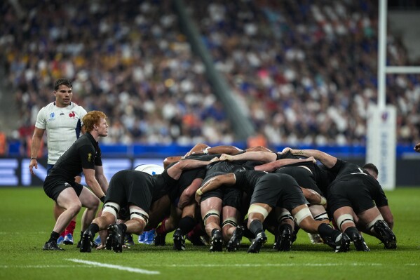 New Zealand's Finlay Christie feeds the ball into a scrum during the Rugby World Cup Pool A match between France and New Zealand at the Stade de France in Saint-Denis, north of Paris, Friday, Sept. 8, 2023. (AP Photo/Lewis Joly)