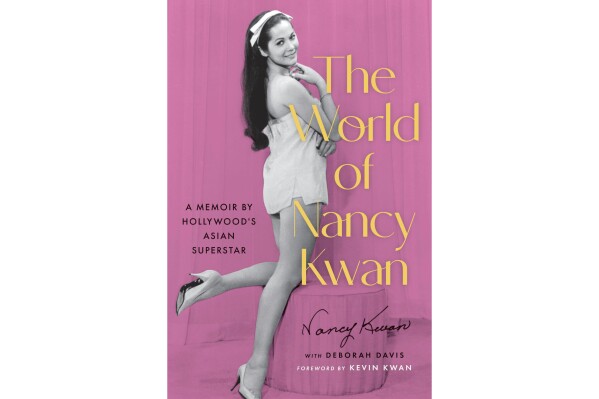 This book cover image released by Legacy Lit shows "The World of Nancy Kwan" by Nany Kwan with Deborah Davis. (Legacy Lit via AP)