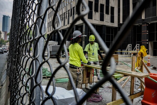 File - Construction workers work with rebar at a site on Tuesday June 6, 2023, in New York. On Friday, The U.S. government issues the June jobs report. (AP Photo/Bebeto Matthews, File)