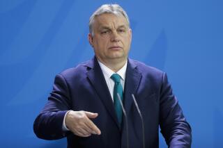 FILE - Hungary's Prime Minister Victor Orban briefs the media in Berlin, Germany, Monday, Feb. 10, 2020. Orban on Tuesday, Feb. 28, 2023, thanked Egypt for its role in capping Europe-bound migration as the two countries inked a series of preliminary agreements in Cairo.(AP Photo/Markus Schreiber, File )