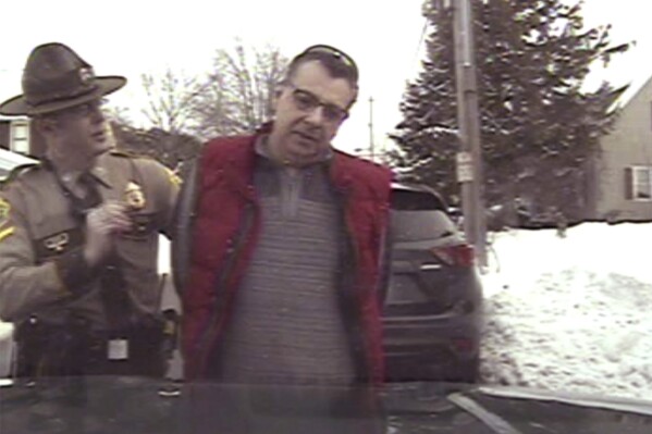  This image taken from police dashcam video shows Gregory Bombard getting arrested on Feb. 9, 2018 n St. Albans, Vt. Vermont has agreed to pay $175,000 to settle a lawsuit on behalf of Bombard who was charged with a crime for giving a state trooper the middle finger in 2018, the state chapter of the American Civil Liberties Union said Wednesday,  June 26, 2024. (American Civil Liberties Union/Vt. State Police via AP)