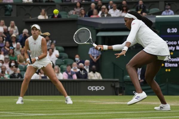 Coco Gauff of the U.S. plays during the women's doubles third round match against Russia's Veronika Kudermetova and Elena Vesnina on day eight of the Wimbledon Tennis Championships in London, Tuesday, July 6, 2021. (AP Photo/Kirsty Wigglesworth)
