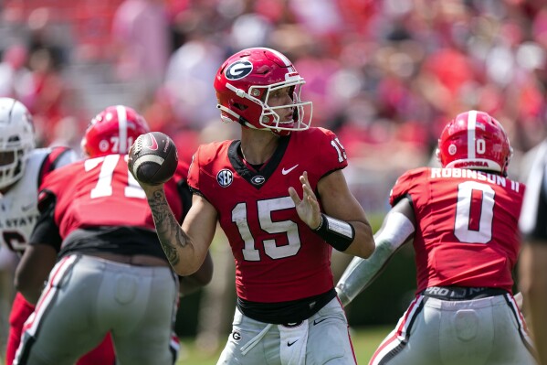 Georgia quarterback Carson Beck (15) looks for an open reciever in the second half of an NCAA college football game against Ball State Saturday, Sept. 9, 2023, in Athens, Ga. (AP Photo/John Bazemore)