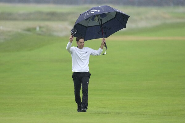 England's Matthew Jordan acknowledges the crowd as he walks onto the 18th green during the final day of the British Open Golf Championships at the Royal Liverpool Golf Club in Hoylake, England, Sunday, July 23, 2023. (AP Photo/Kin Cheung)