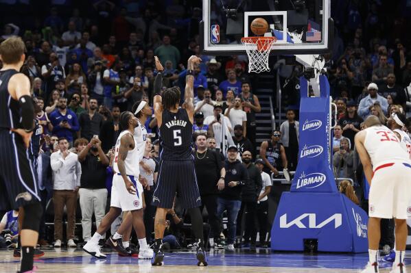 Orlando Magic forward Paolo Banchero shoots.a free throw against the Los Angeles Clipper during overtime in an NBA basketball game Wednesday, Dec. 7, 2022, in Orlando, Fla. (AP Photo/Scott Audette)