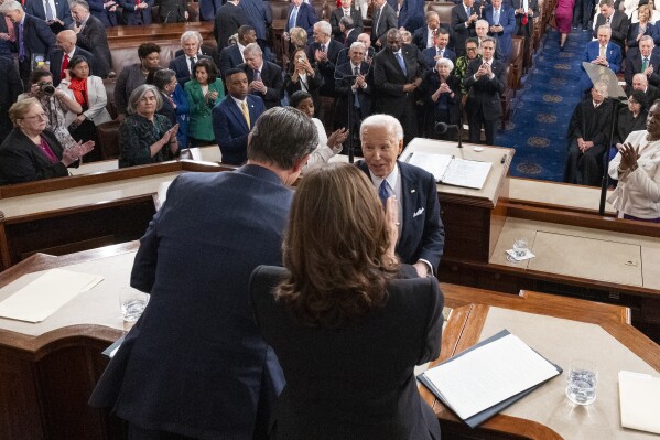 President Joe Biden greets House Speaker Mike Johnson of La., left, and Vice President Kamala Harris after delivering the State of the Union address to a joint session of Congress at the U.S. Capitol, Thursday March 7, 2024, in Washington. (AP Photo/Alex Brandon, Pool)