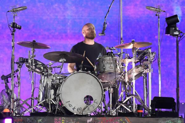 Coldplay drummer Will Champion and his drum technician known as
