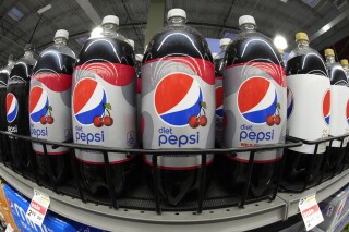 FILE - Bottles of Diet Pepsi Wild Cherry are displayed at a market in Pittsburgh on Jan. 26, 2023. PepsiCo's revenue rose 7% in the third quarter despite lower demand as the company continued to hike prices. (AP Photo/Gene J. Puskar, File)